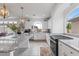 Well-lit kitchen boasting granite counters, stainless appliances, and a center island with seating at 6346 Rock Strm Ln, Las Vegas, NV 89141