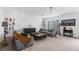 Spacious living room featuring two sofas, modern decor, and neutral carpet at 6346 Rock Strm Ln, Las Vegas, NV 89141