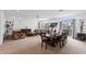 Open-concept living and dining space with neutral carpet and contemporary decor at 6346 Rock Strm Ln, Las Vegas, NV 89141