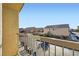 Balcony view showcasing a neighborhood street with well-maintained houses and clear blue skies at 6637 Lookout Lodge Ln # 1, North Las Vegas, NV 89084