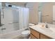 Functional bathroom features a shower-tub combo, and a vanity with sink and storage at 6637 Lookout Lodge Ln # 1, North Las Vegas, NV 89084