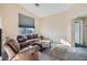 Cozy living room with vaulted ceilings, neutral walls, carpet flooring, and comfortable seating at 6637 Lookout Lodge Ln # 1, North Las Vegas, NV 89084