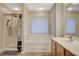 Clean bathroom featuring a shower, soaking tub, and vanity with a spacious countertop at 6828 Sumatra St, Las Vegas, NV 89166