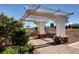 Inviting community park pergola featuring a stone bench for relaxing and enjoying the outdoor scenery at 6828 Sumatra St, Las Vegas, NV 89166