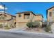 Charming two-story home with a well-maintained exterior, a private balcony and desert landscaping at 6828 Sumatra St, Las Vegas, NV 89166