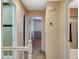 Neutral hallway with doorways leading to the bedrooms and bathrooms creating great flow throughout the home at 6828 Sumatra St, Las Vegas, NV 89166