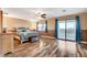 Spacious main bedroom with balcony access, neutral walls, and modern ceiling fan at 6828 Sumatra St, Las Vegas, NV 89166