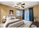 Bright main bedroom with large window and sliding glass doors creating a light and airy space at 6828 Sumatra St, Las Vegas, NV 89166