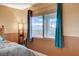 Bright main bedroom features natural light and views through large windows at 6828 Sumatra St, Las Vegas, NV 89166