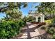 Shaded walkway with landscaped pathway leading to a pergola at 6828 Sumatra St, Las Vegas, NV 89166