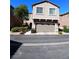 Two story home featuring an attached 2 car garage and desert landscaping at 684 Calamus Palm Pl, Henderson, NV 89011