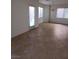 Living room featuring tile flooring, bright windows, and a chandelier at 684 Calamus Palm Pl, Henderson, NV 89011
