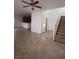 Open living room featuring tile flooring and a stairway at 684 Calamus Palm Pl, Henderson, NV 89011