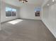 Spacious carpeted bedroom with large windows offering natural light and views at 6913 Mill Creek Way, Las Vegas, NV 89149