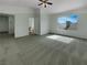 Large primary bedroom with carpet, ceiling fan, and connected primary bath at 6913 Mill Creek Way, Las Vegas, NV 89149