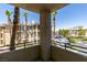 Balcony view of the community and landscaping, with palm trees around at 7151 S Durango Dr # 211, Las Vegas, NV 89113