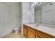 A full bath includes a vanity with wood cabinets and a shower and tub combo at 7151 S Durango Dr # 211, Las Vegas, NV 89113