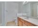 Bright bathroom features a wood vanity and a shower and tub combo at 7151 S Durango Dr # 211, Las Vegas, NV 89113