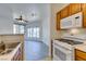 Kitchen flows into a bright living space with modern appliances at 7151 S Durango Dr # 211, Las Vegas, NV 89113