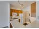 Efficient kitchen setup includes a laundry closet and track lighting at 7151 S Durango Dr # 211, Las Vegas, NV 89113