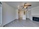 Open floor plan featuring gray wood floors, fireplace, and a view to the kitchen at 7151 S Durango Dr # 211, Las Vegas, NV 89113