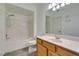 Bright bathroom with a tub/shower combo and a wood vanity at 7163 S Durango Dr # 302, Las Vegas, NV 89113