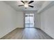 Bright bedroom with wood-look flooring and a sliding glass door to the patio at 7163 S Durango Dr # 302, Las Vegas, NV 89113