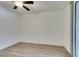 Clean, vacant bedroom features wood-look flooring and a sliding glass door at 7163 S Durango Dr # 302, Las Vegas, NV 89113