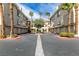Well maintained condominium complex courtyard with mature palm trees and ample parking at 7163 S Durango Dr # 302, Las Vegas, NV 89113