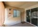 Inviting front entrance featuring a neutral door, window, and charming 'hello' doormat, leading into a cozy home at 7163 S Durango Dr # 302, Las Vegas, NV 89113