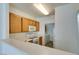 Efficient kitchen layout with wood cabinets and modern appliances at 7163 S Durango Dr # 302, Las Vegas, NV 89113