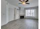 Open living room featuring wood-look flooring and a fireplace at 7163 S Durango Dr # 302, Las Vegas, NV 89113