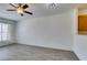 Inviting living room with wood-look floors and a ceiling fan at 7163 S Durango Dr # 302, Las Vegas, NV 89113