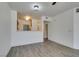 Open living space with wood-look floors and neutral wall paint at 7163 S Durango Dr # 302, Las Vegas, NV 89113