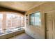 Relaxing patio area with privacy screen, offering a serene outdoor space with views of palm trees and neighborhood at 7163 S Durango Dr # 302, Las Vegas, NV 89113