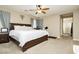 View of the Primary Bedroom featuring a ceiling fan, carpet, and a large bed at 7214 Regent Pond St, Las Vegas, NV 89166