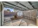 View of a covered patio looking out to a spacious backyard and a storage shed, perfect for outdoor projects at 806 Fireweed Dr, Henderson, NV 89002