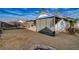 Exterior backyard showcasing covered patio and yard space, blending the comforts of indoor and outdoor living at 806 Fireweed Dr, Henderson, NV 89002