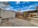 A low-maintenance backyard featuring a covered patio and storage shed on a sunny day at 806 Fireweed Dr, Henderson, NV 89002