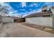 Exterior view showcasing the back of the house and a brick patio with spacious yard at 806 Fireweed Dr, Henderson, NV 89002