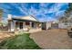 Home's backyard features a covered patio, gravel area, and artificial turf, offering a low-maintenance outdoor space at 806 Fireweed Dr, Henderson, NV 89002