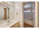 Bathroom featuring a vanity with lighting and a view into the shower/tub combo at 806 Fireweed Dr, Henderson, NV 89002