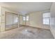 Bedroom with carpet flooring, closet with mirror sliding doors, and a window at 806 Fireweed Dr, Henderson, NV 89002