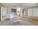 Spacious bedroom with carpet, mirrored closet doors, and access to the bathroom at 806 Fireweed Dr, Henderson, NV 89002