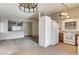 Open concept kitchen with tile floors, white cabinets, and modern appliances at 806 Fireweed Dr, Henderson, NV 89002