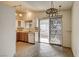 This cozy kitchen features tile floors, stainless steel sink, and sliding door access to the patio at 806 Fireweed Dr, Henderson, NV 89002
