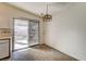 This kitchen's dining area offers tile floors and sliding door access to the backyard at 806 Fireweed Dr, Henderson, NV 89002
