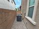 Compact AC unit installed in a narrow side yard, ensuring efficient cooling and space utilization at 8105 Switchback Run St, Las Vegas, NV 89166