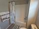 Bathroom with a shower-tub combo and stylish nautical-themed shower curtain at 8105 Switchback Run St, Las Vegas, NV 89166