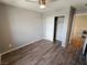 Bedroom featuring hard surface flooring and a closet with white sliding doors at 8105 Switchback Run St, Las Vegas, NV 89166